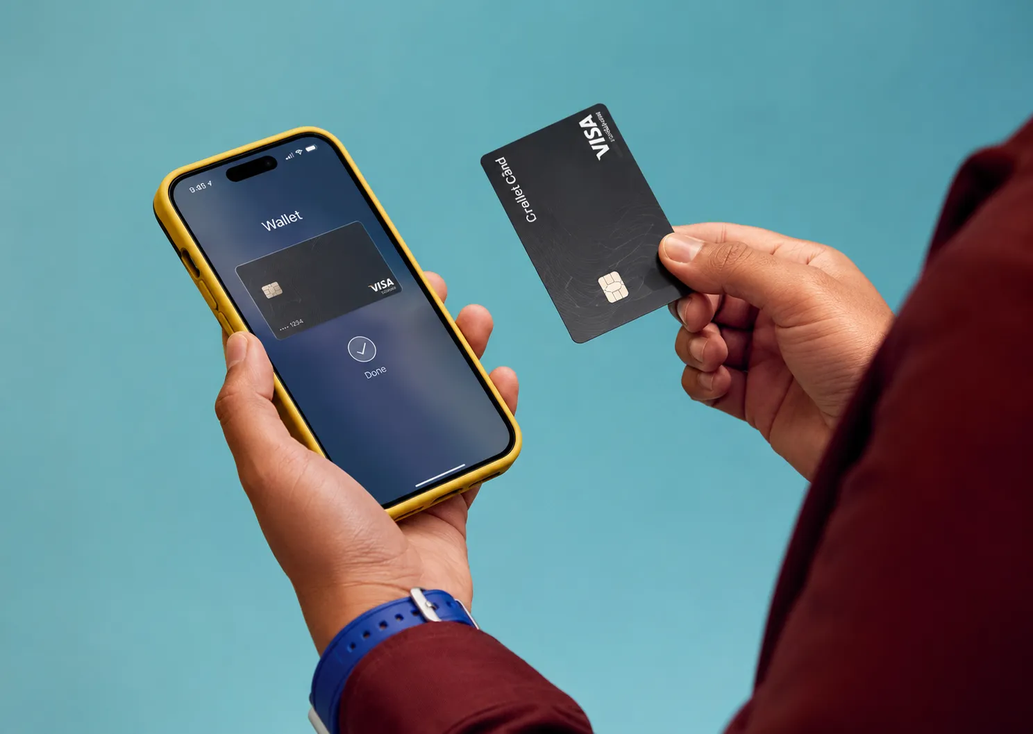 Hands holding a phone with a digital wallet and a payment card
