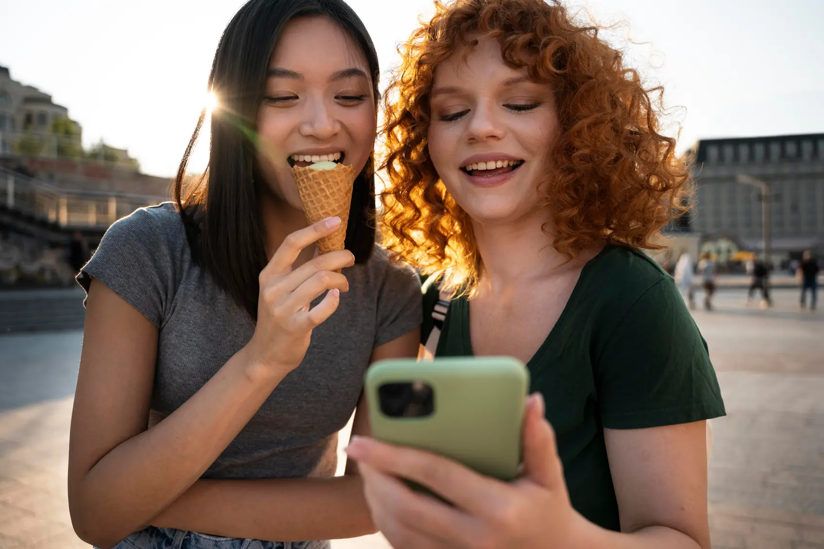 Two friends laughing while paying with the Fexiva app